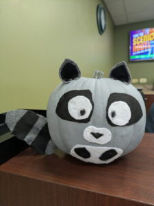 pumpkin decorated as Jimothy the Raccoon